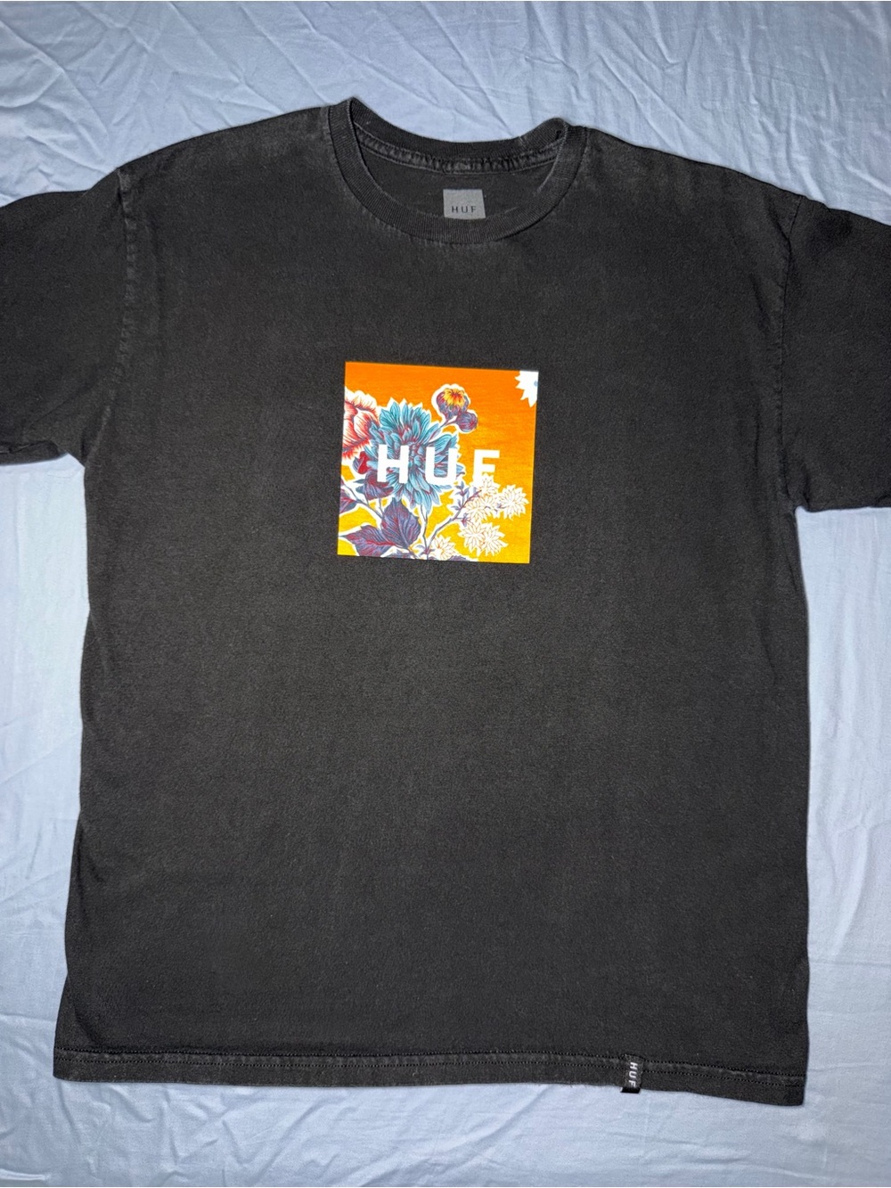 HUF Black Tee with Orange Floral Box Logo